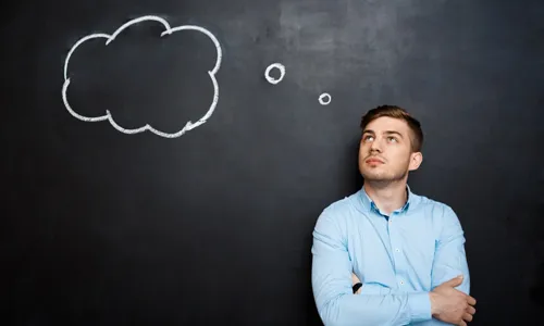 Confused man imagining faces and dream characters