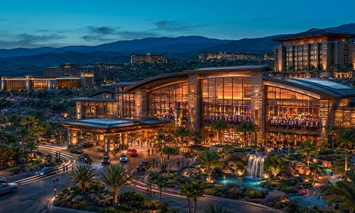Busy tribal casino gaming floor in California with multiple slot machine banks