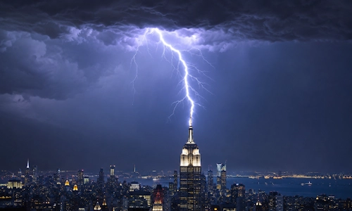 Lightning striking the Empire State Building during a nighttime thunderstorm over New York City